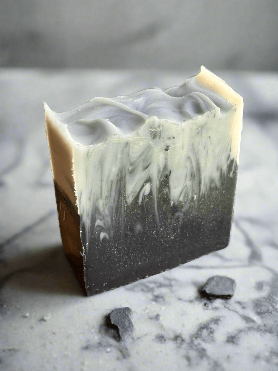 Charcoal Facial Soap with a marbled design, ideal for acne-prone skin, drawing out impurities and excess oil.