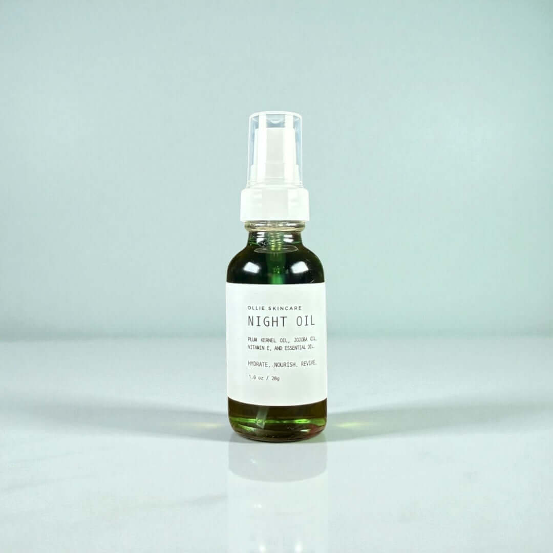 Night Facial Oil in a glass bottle showcasing its nourishing plum and jojoba oils for hydration and skin protection.