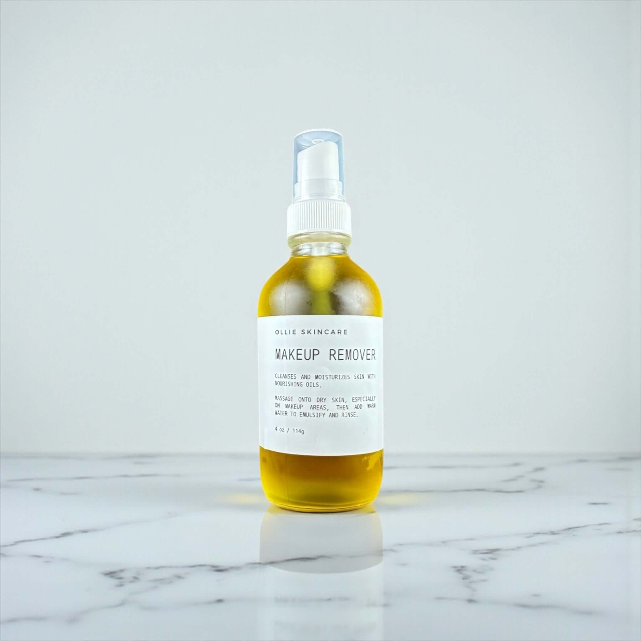 Ollie Skincare Makeup Remover in a glass bottle, effectively dissolves makeup and nourishes skin.
