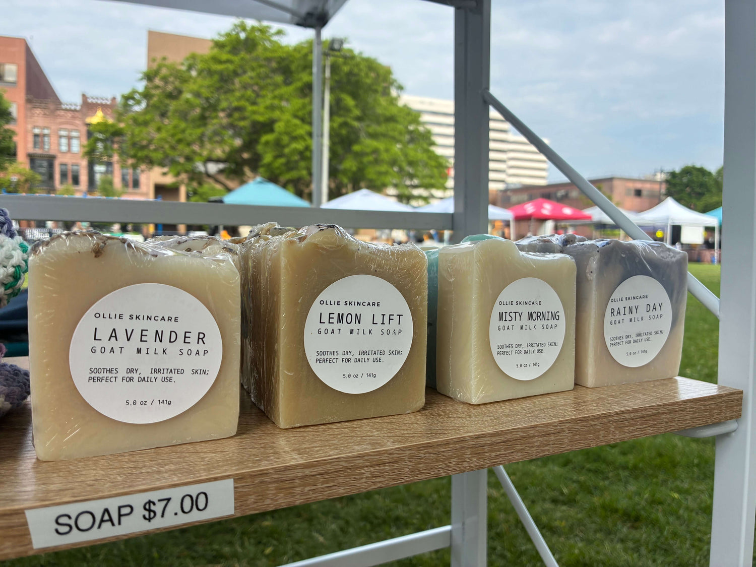 Wisconsin Goat Milk Soap: Handcrafted Natural Skincare from America’s Dairyland displayed at a market booth.