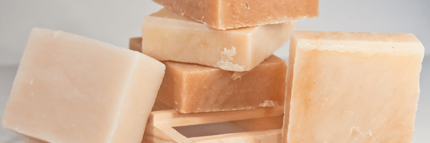 A stack of goat's milk soap bars highlighting the skin-soothing benefits of goat's milk soap.