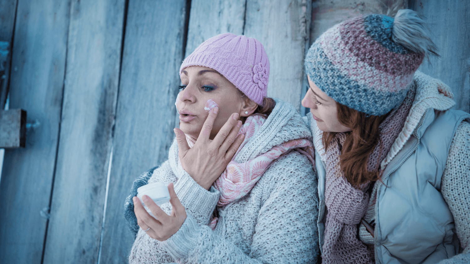 7 Tips for Keeping Your Skin Hydrated During Cold Weather: women applying moisturizer in winter
