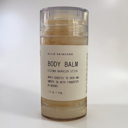 Ollie Skincare Body Balm tin, a rich, nourishing balm for dry skin.