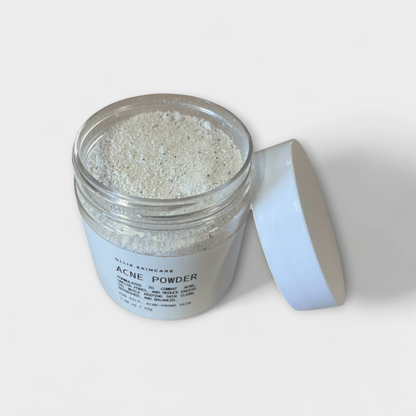 Cleansing grains in a transparent jar with a white lid, ideal for acne treatment.