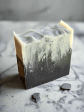 Charcoal Facial Soap with a marbled design, ideal for acne-prone skin, drawing out impurities and excess oil.