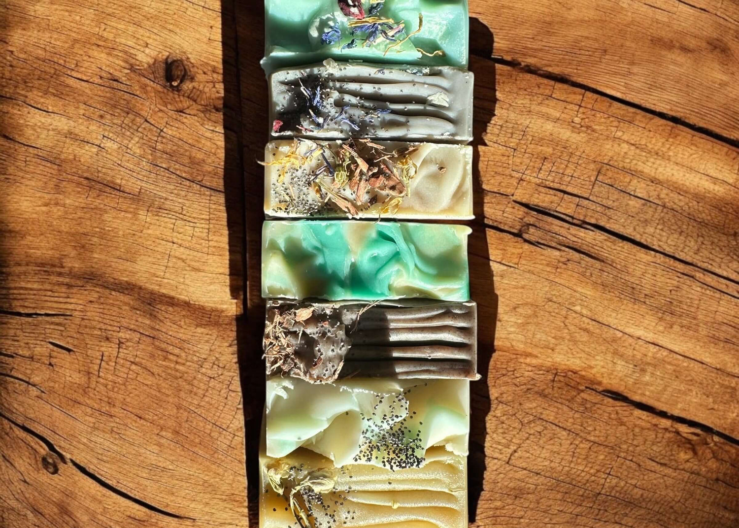 Artisanal Goat Milk Soap bars with vibrant colors, perfect for gentle cleansing.