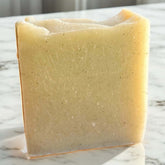 Handmade cold processed clay soap bar made with goat milk and rose kaolin clay for gentle cleansing.