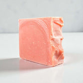 Handmade clay soap bar in pink color, featuring a smooth texture and artisanal craftsmanship.