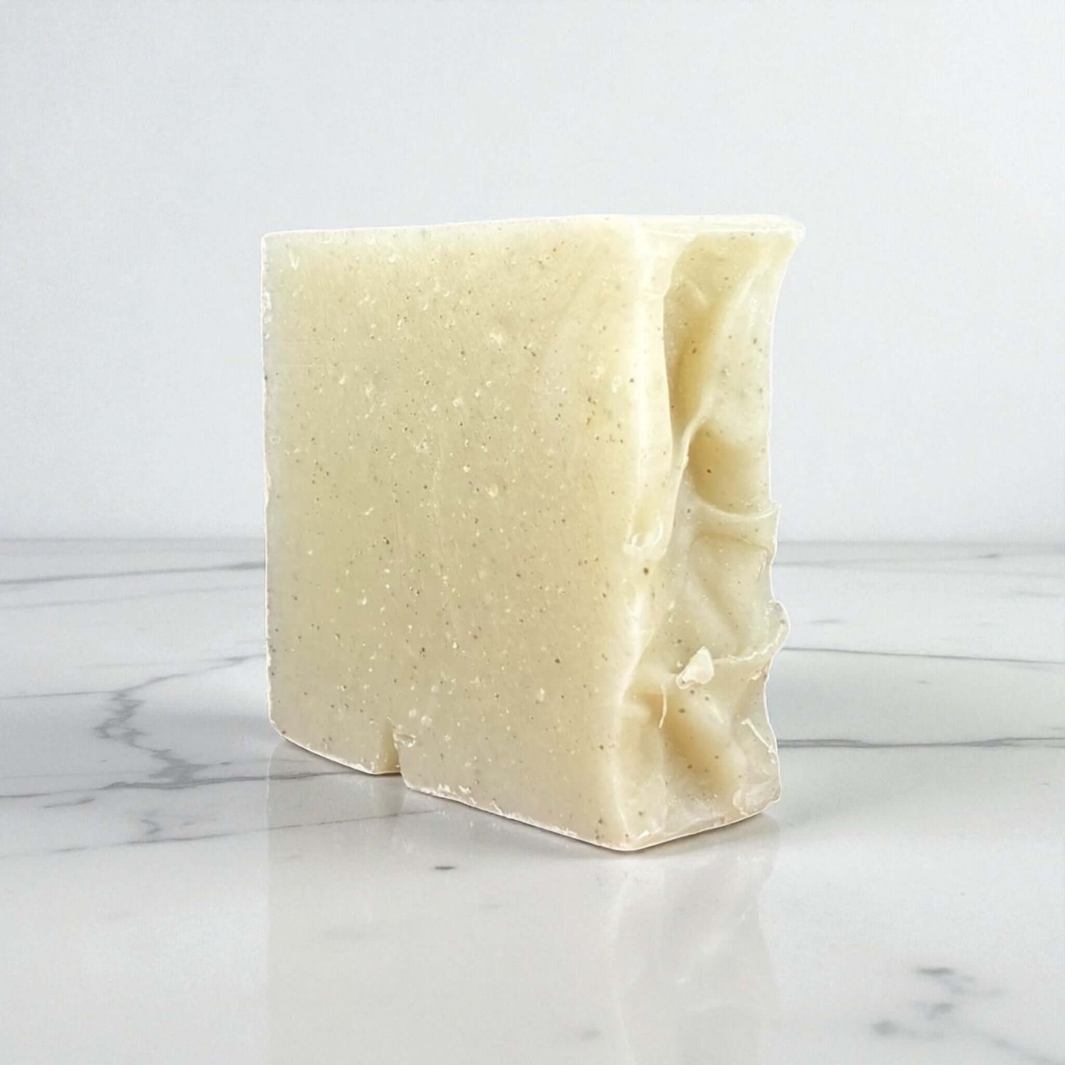 Handmade clay soap bar made with goat milk and rose kaolin clay, perfect for gentle cleansing and skin purification.