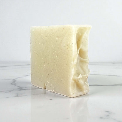 Handmade clay soap bar made with goat milk and rose kaolin clay, perfect for gentle cleansing and skin purification.