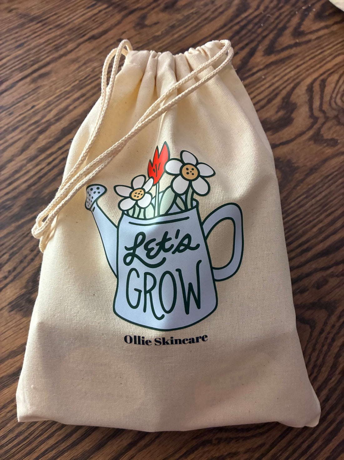 Beige drawstring bag with &