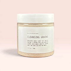 Cleansing Grains jar, a gentle powder-to-paste cleanser for glowing skin.