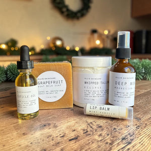 Cuticle oil, Grapefruit goat milk soap, Whipped Tallow, magnesium oil spray and lip balm from the Winter Skin Rescue gift set.