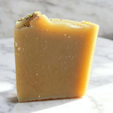 Lemon Lift Goat Milk Soap bar showcasing its creamy texture and natural ingredients.