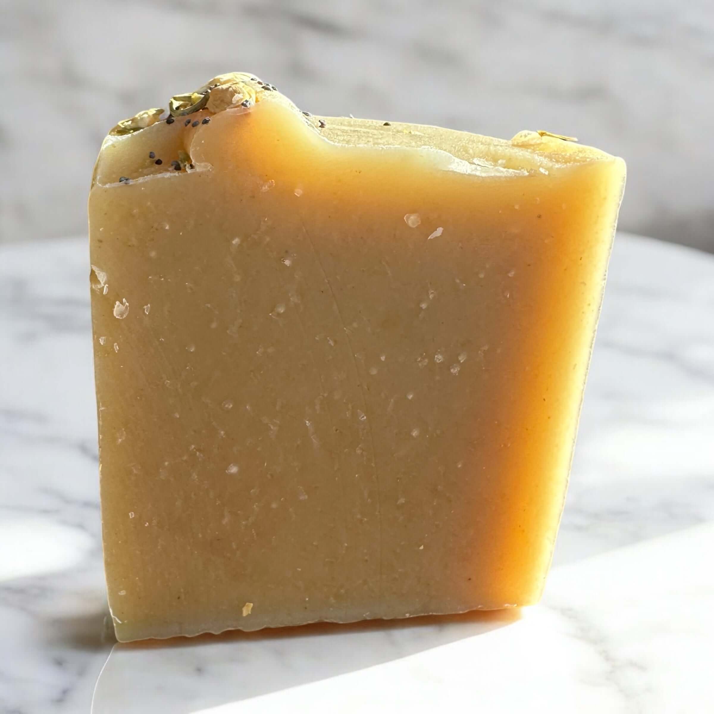 Lemon Lift Goat Milk Soap bar showcasing its creamy texture and natural ingredients.