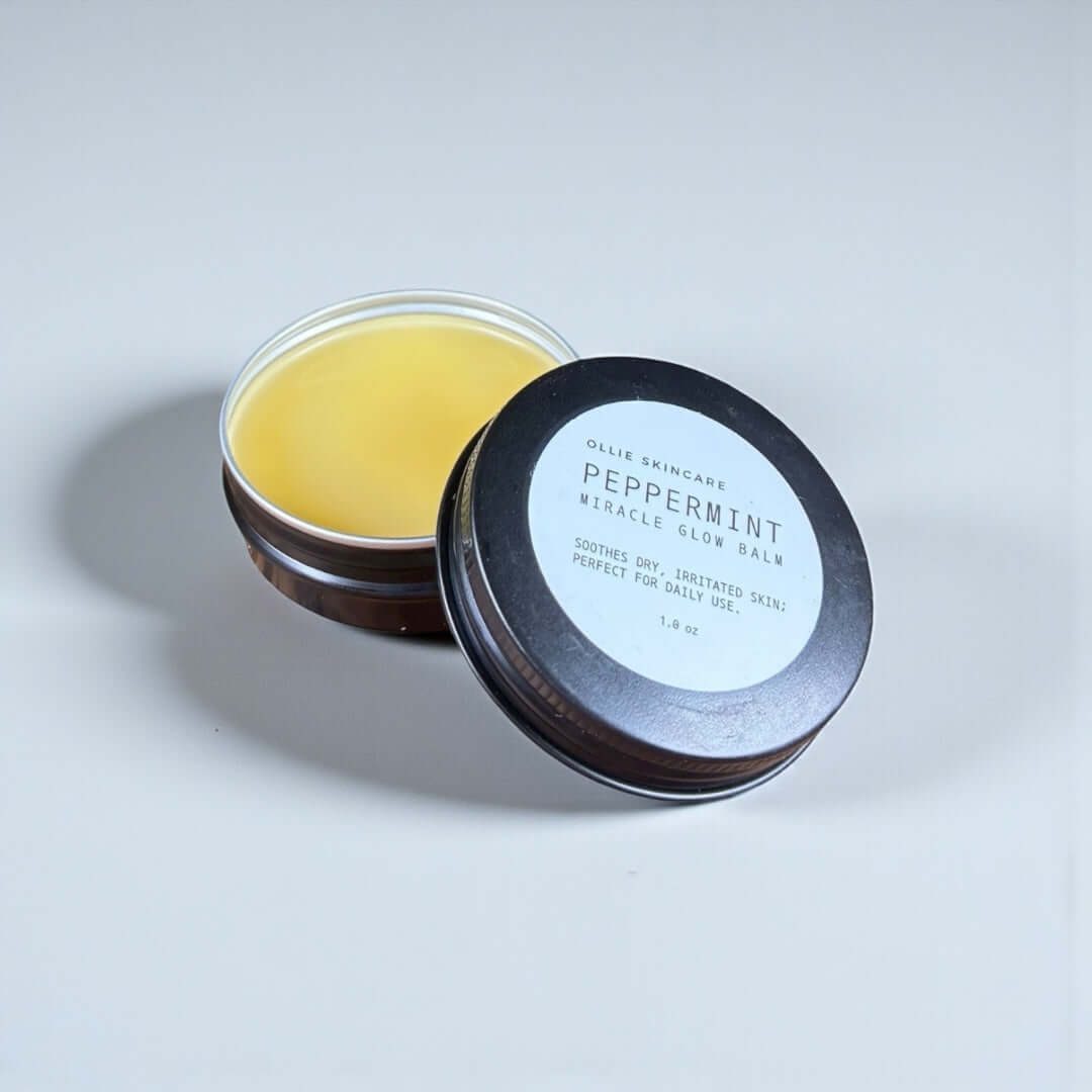 Miracle Glow Balm in a compact tin, a versatile skin balm for moisturizing and revitalizing skin.