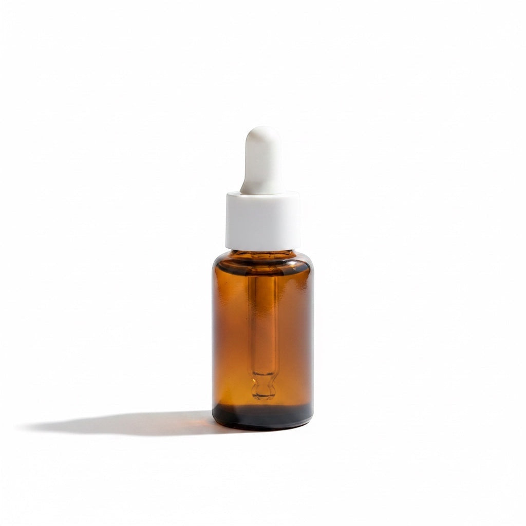 OLLIE SKINCARE Bakuchiol Facial Oil in an amber glass dropper bottle with a white cap against a white background.