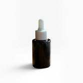OLLIE SKINCARE Bakuchiol Facial Oil in a dark amber glass dropper bottle with a white cap against a white background.