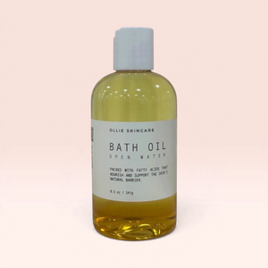 OLLIE SKINCARE 8.5 oz bottle of moisturizing bath oil with lavender, lemongrass, and orange essential oils.