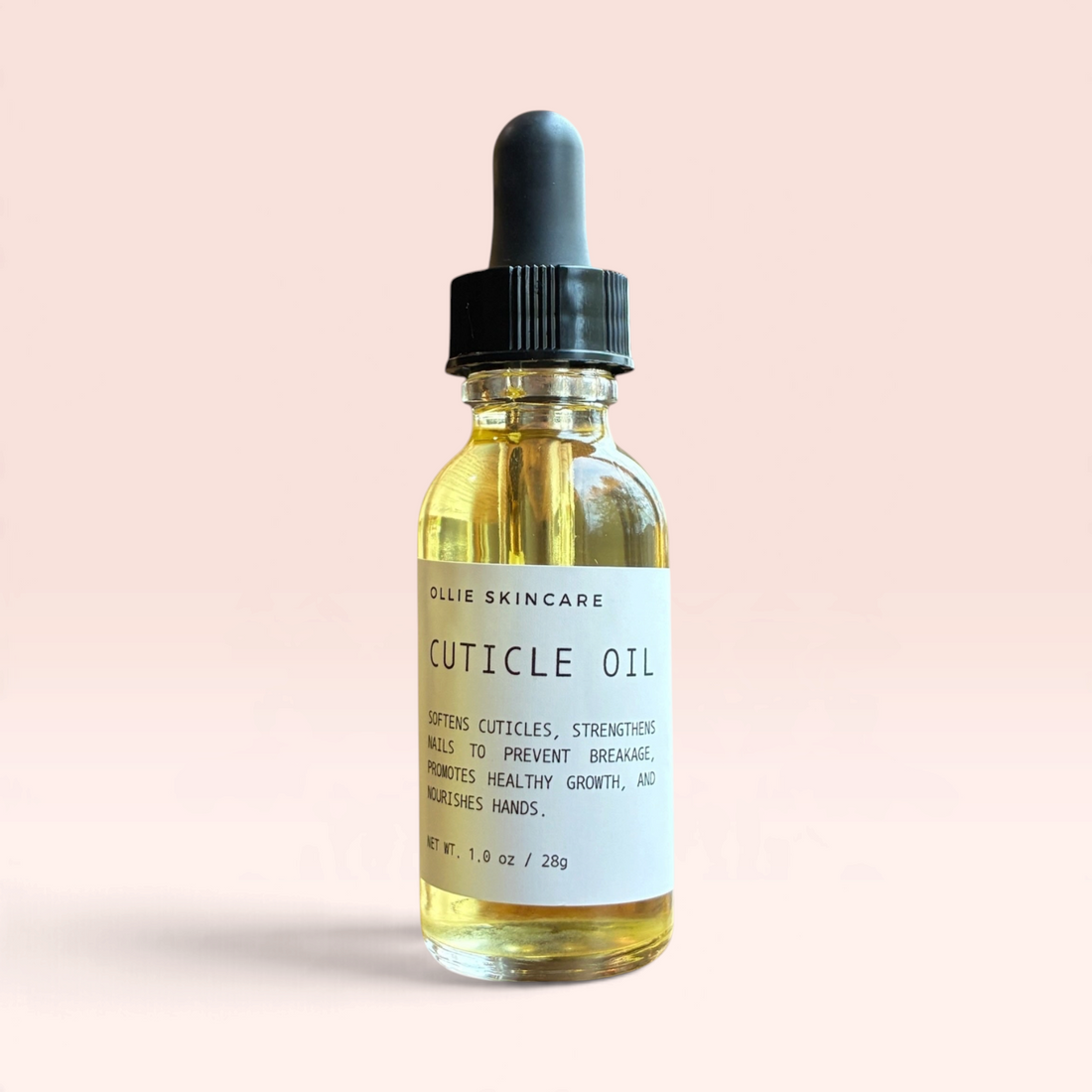 OLLIE SKINCARE nourishing cuticle oil in a clear glass dropper bottle for hydrating and strengthening nails.