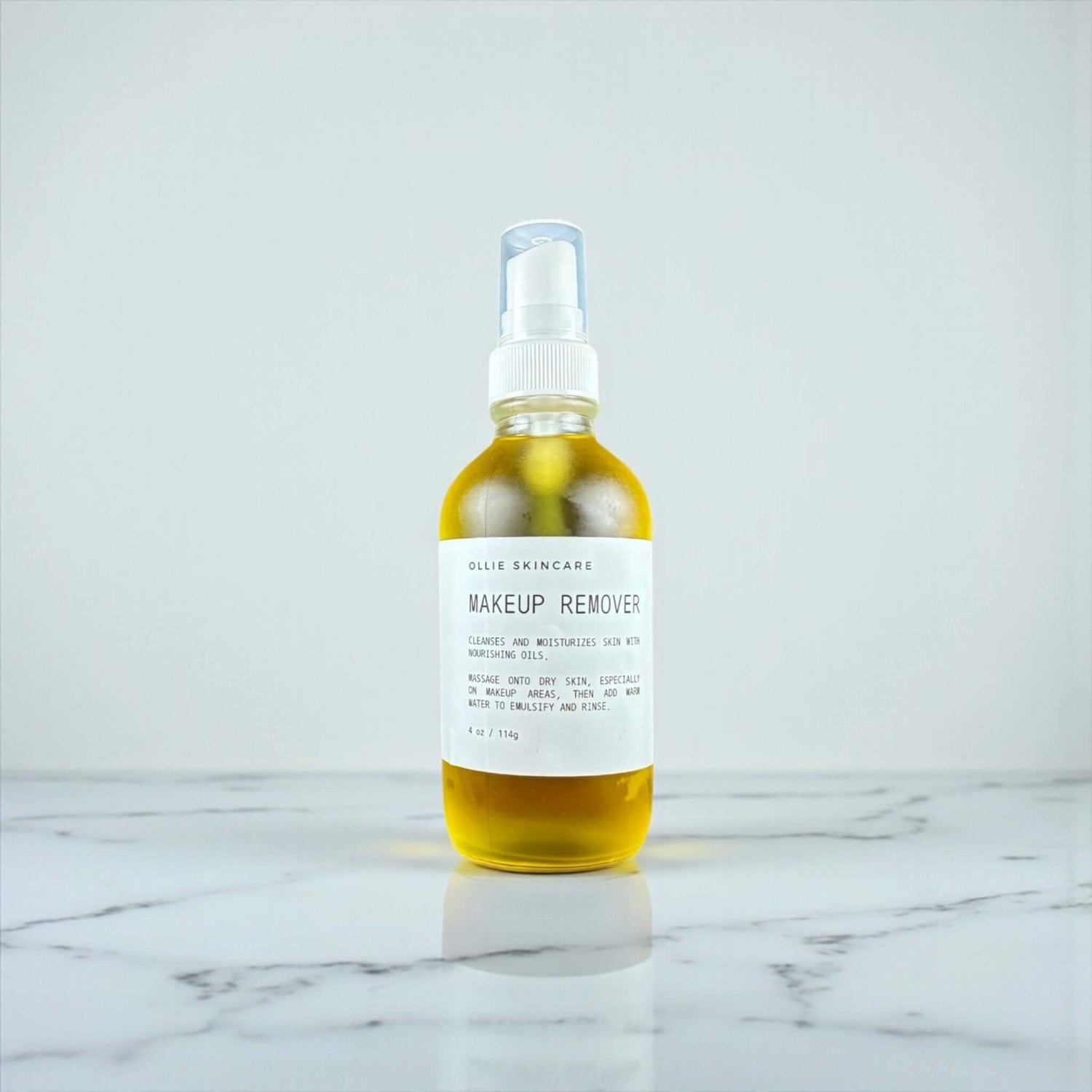 Ollie Skincare Makeup Remover in a glass bottle, effectively dissolves makeup and nourishes skin.