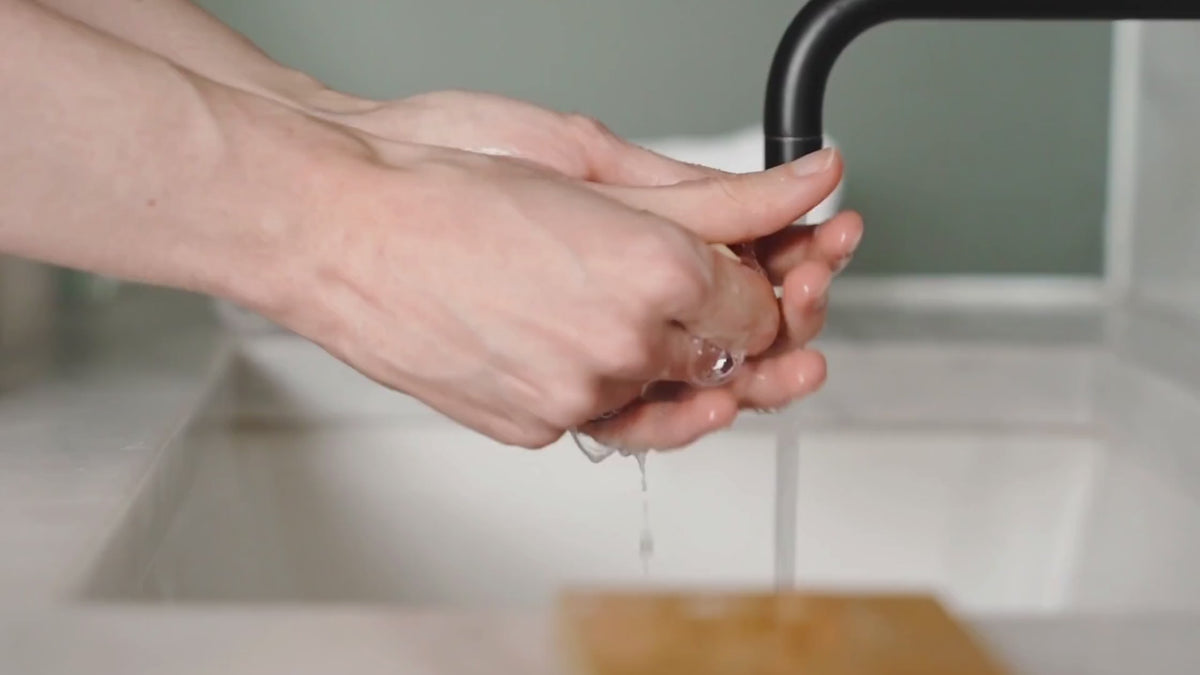 Hands washing with a bar of soap