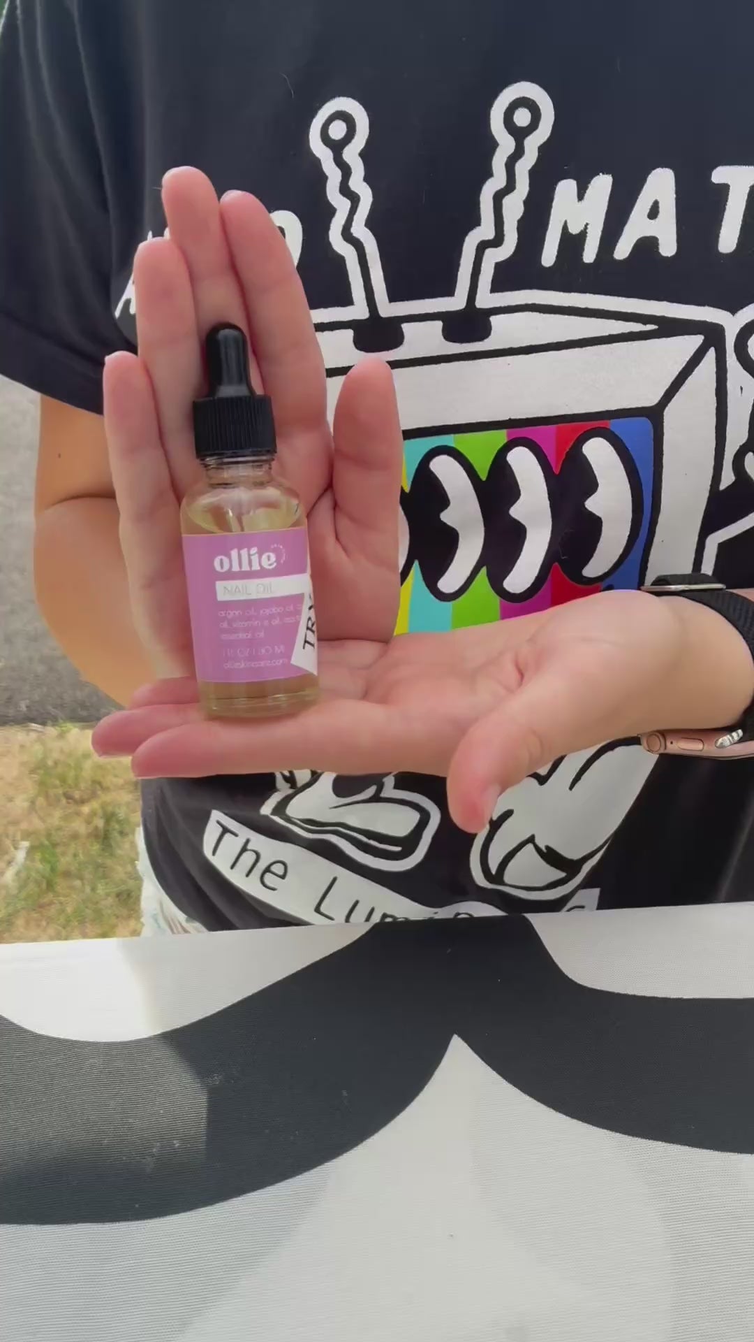 Cuticle Oil in a dropper bottle held in a hand, promoting nail care and nourishment.