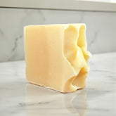 Ramblewood Goat Milk Soap bar with soft texture, handcrafted in Wisconsin for deep hydration and self-care.