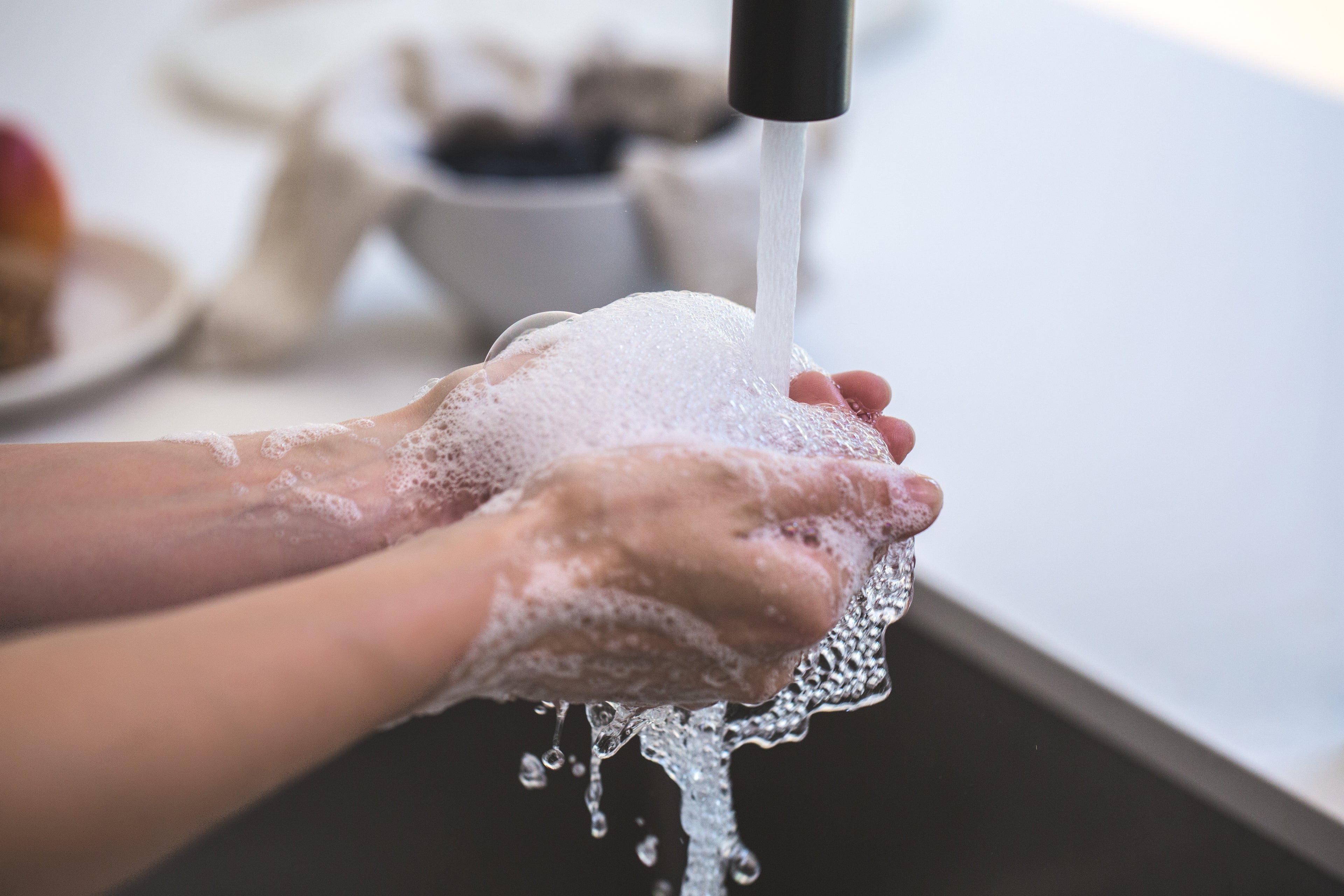 Washing Hands with Goat Milk Soap