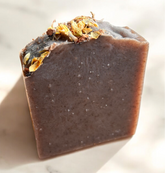 Roughcut Goat Milk Soap featuring natural ingredients and flower petals, handcrafted for gentle skin cleansing.