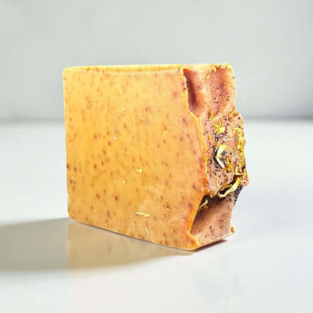 Tangerine Twist Goat Milk Soap artisanal cold-processed bar with ginger, turmeric, and orange ingredients.