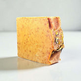 Tangerine Twist Goat Milk Soap artisanal cold-processed bar with ginger, turmeric, and orange ingredients.