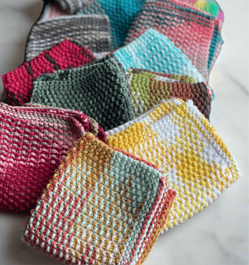 Colorful hand-knit wash cloths made from soft cotton yarn, showcasing unique patterns and textures.
