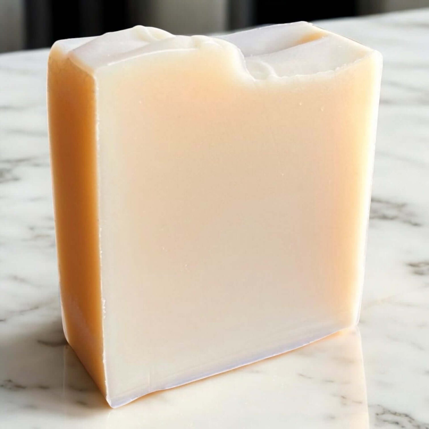 Unscented Goat Milk Soap bar on a marble surface showcasing its creamy texture.