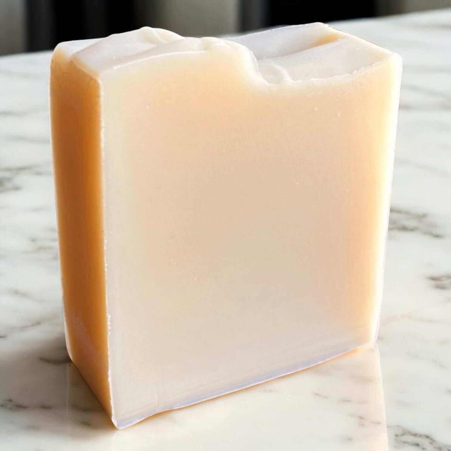 Unscented Goat Milk Soap bar on a marble surface showcasing its creamy texture.