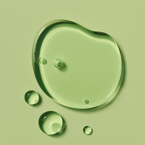 Green liquid droplets on a green background