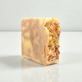Wildwood Goat Milk Soap bar with natural ingredients and floral accents, handmade in Wisconsin.