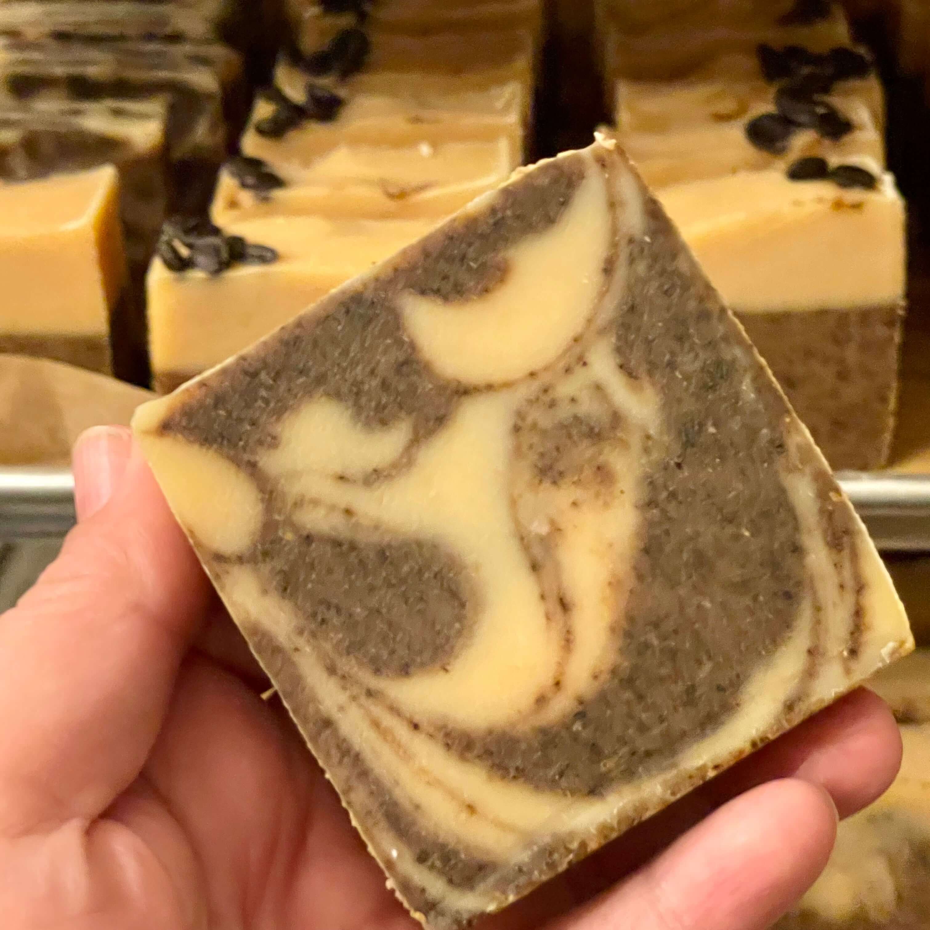 Bold Brew Coffee Soap with swirls of goat milk, showcasing gentle cleansing and exfoliating properties.