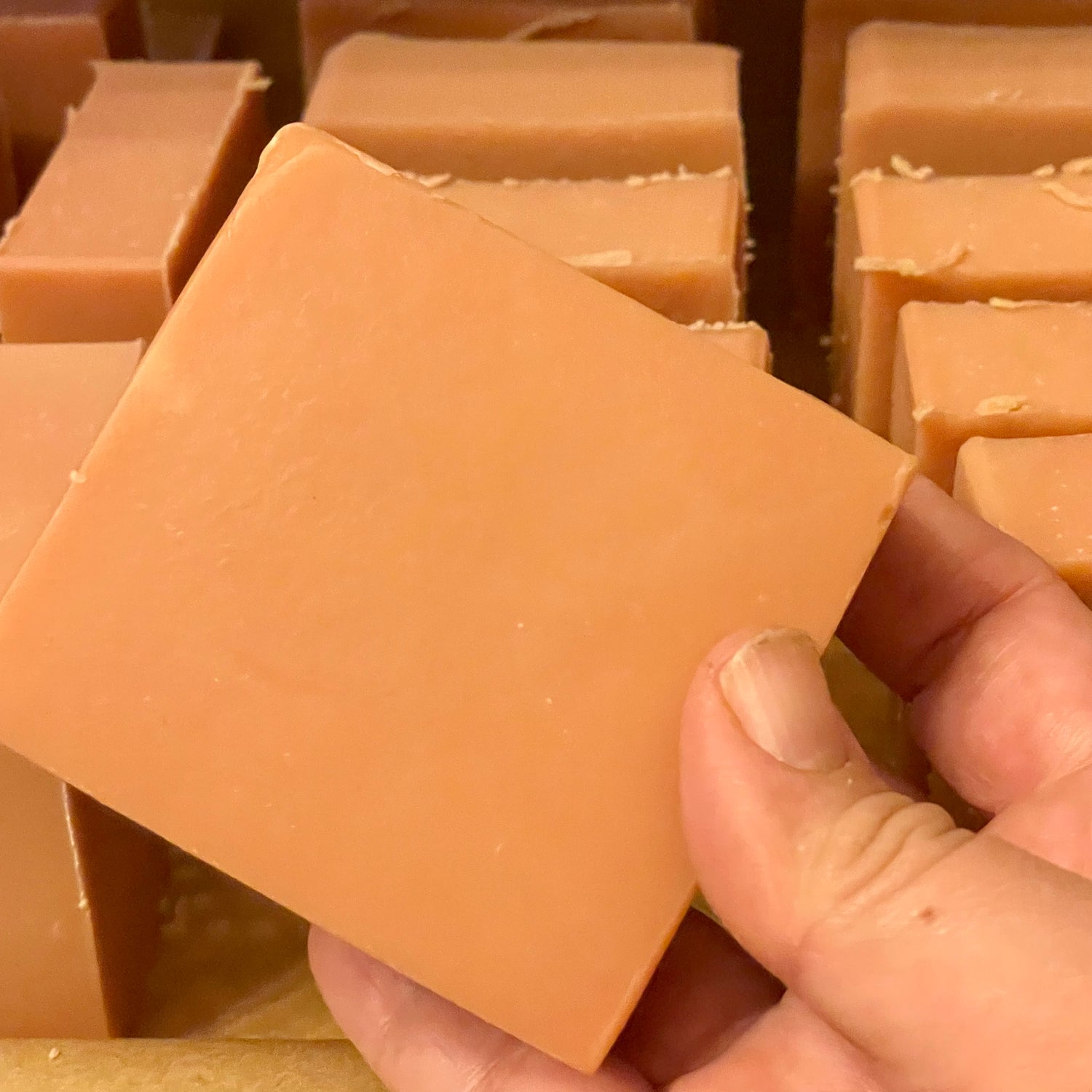 Handmade clay soap bar made with goat milk and rose kaolin clay, perfect for gentle cleansing and skin purification.